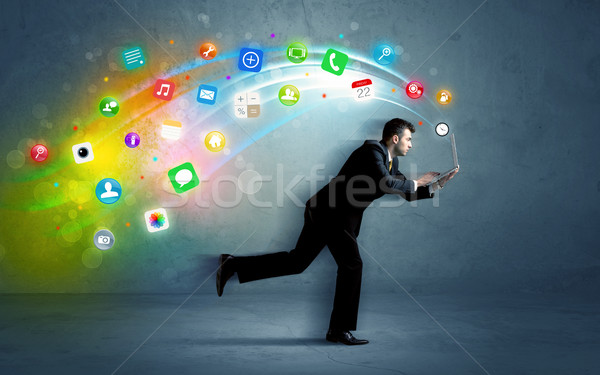 Stock photo: Running businessman with application icons from device