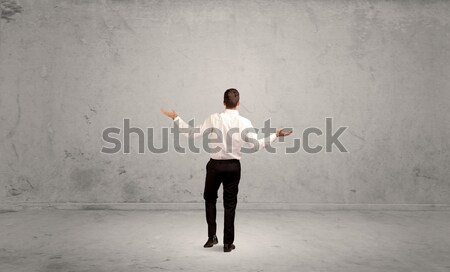 Running businessman with device in hand Stock photo © ra2studio