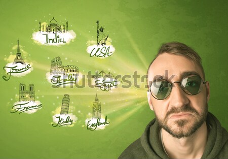 Happy young man with sunglasses traveling to cities around the w Stock photo © ra2studio