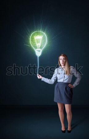 [[stock_photo]]: Femme · d'affaires · idée · ampoule · tenir · brillant · bleu