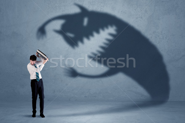 Business man afraid of his own shadow monster concept Stock photo © ra2studio