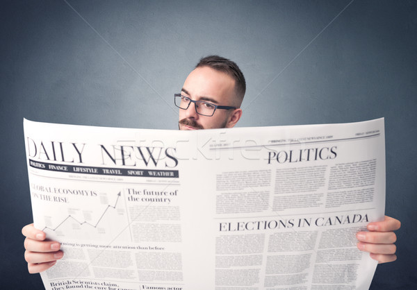 Businessman reading newspaper Stock photo © ra2studio