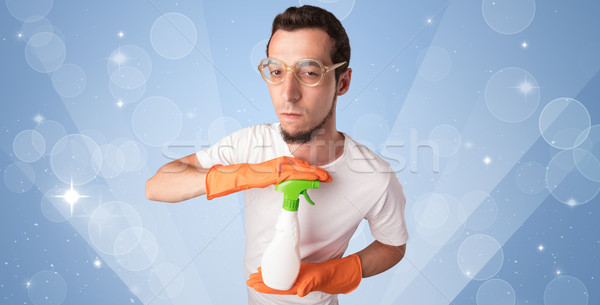 Stock photo: Glittered background with male housekeeper