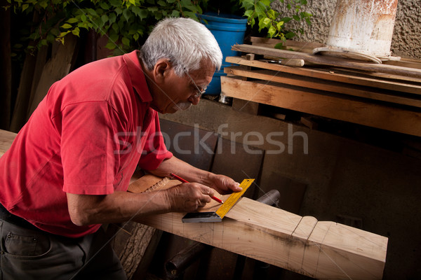 Old woodcarver working with mallet Stock photo © ra2studio