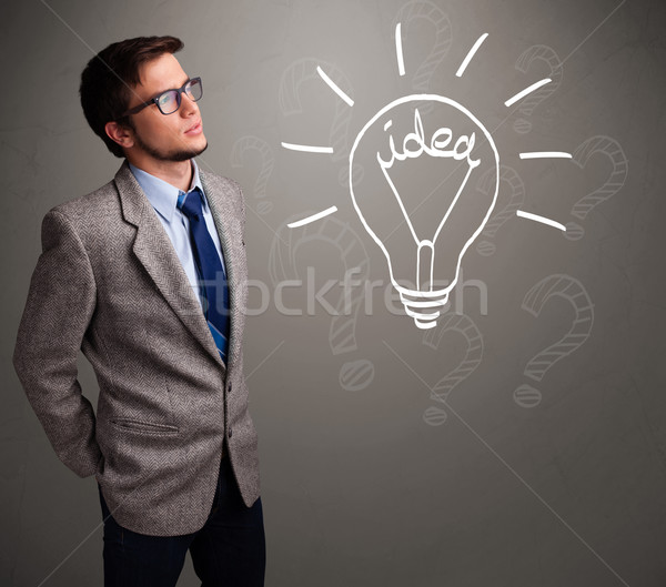 Young boy comming up with a light bulb idea sign Stock photo © ra2studio