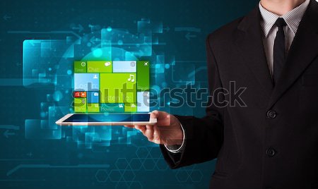 Lady holding tablet with modern software operational system Stock photo © ra2studio