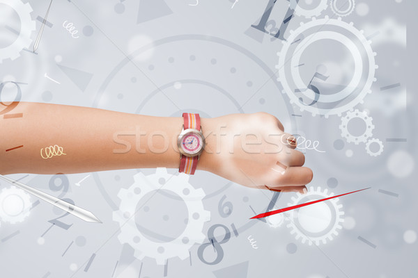 Hand with watch and numbers on the side comming out Stock photo © ra2studio