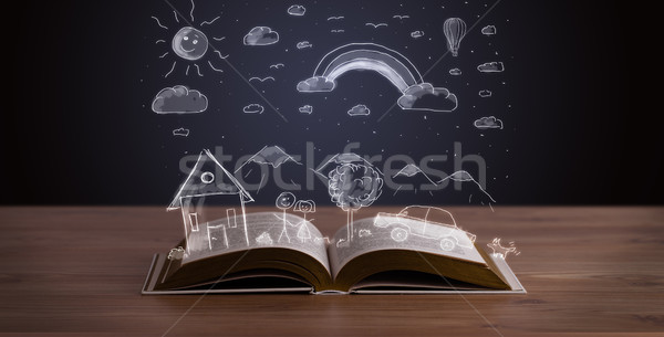 Stock photo: Open book with hand drawn landscape 