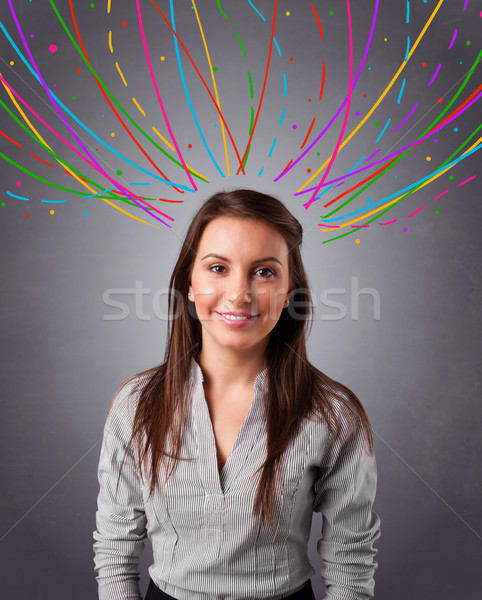 Young girl thinking with colorful abstract lines overhead Stock photo © ra2studio