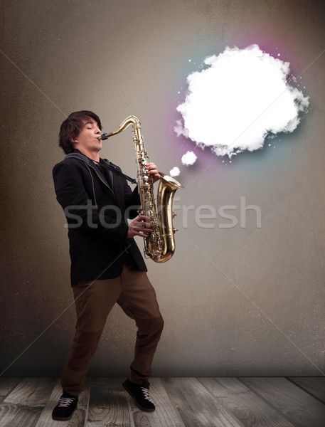 Junger Mann spielen Saxophon Kopie Raum weiß Wolke Stock foto © ra2studio