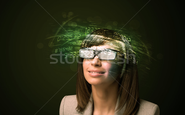 Business woman looking at high tech number calculations  Stock photo © ra2studio