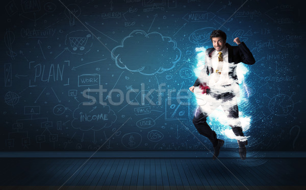 Happy business man jumping with storm cloud around him  Stock photo © ra2studio