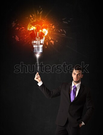 üzletember robbanás villanykörte fekete mosoly erő Stock fotó © ra2studio