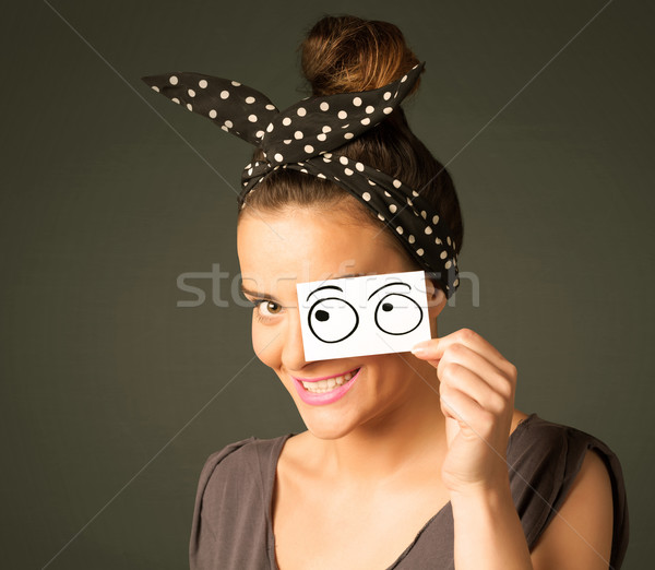 Young silly girl looking with hand drawn eye balls on paper Stock photo © ra2studio