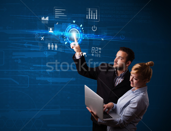 Young business couple touching future web technology buttons and Stock photo © ra2studio