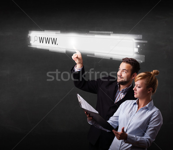 Jeunes affaires couple toucher web navigateur Photo stock © ra2studio