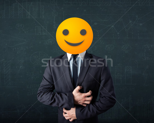 businessman wears yellow smiley face Stock photo © ra2studio