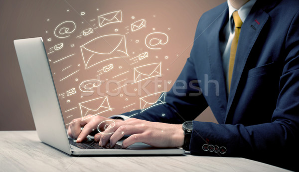 Sending client news letters on laptop Stock photo © ra2studio