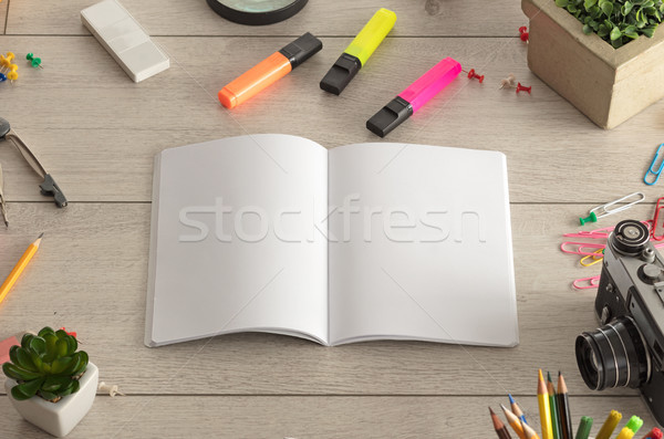 Notebook on the floor with office tools nearby Stock photo © ra2studio