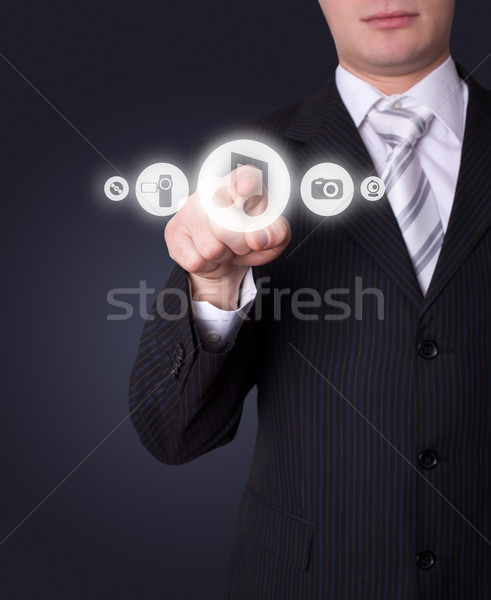 Man pressing media player button Stock photo © ra2studio
