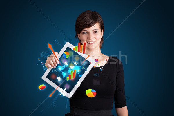 woman holding modern tablet with colorful diagrams and graphs Stock photo © ra2studio