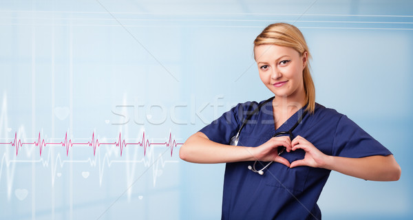 Bastante médico escuta vermelho pulso coração Foto stock © ra2studio