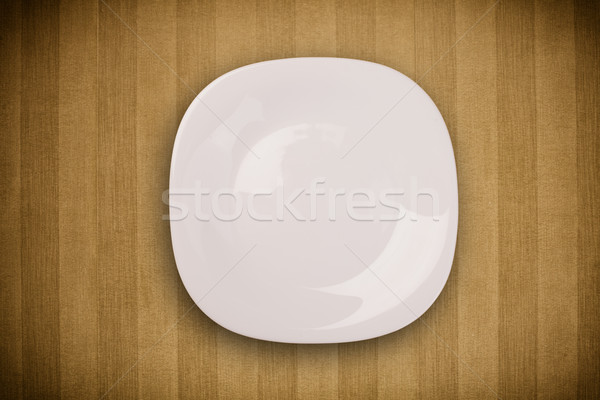 Colorful empty plate on grungy background table  Stock photo © ra2studio