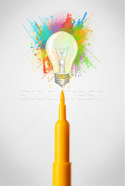 Felt pen close-up with colored paint splashes and lightbulb Stock photo © ra2studio