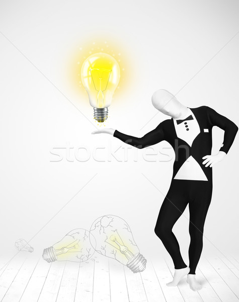 Man in full body with glowing light bulb Stock photo © ra2studio