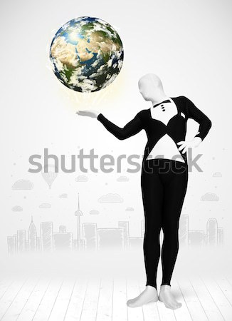 Businesswoman on rock mountain with a globe Stock photo © ra2studio