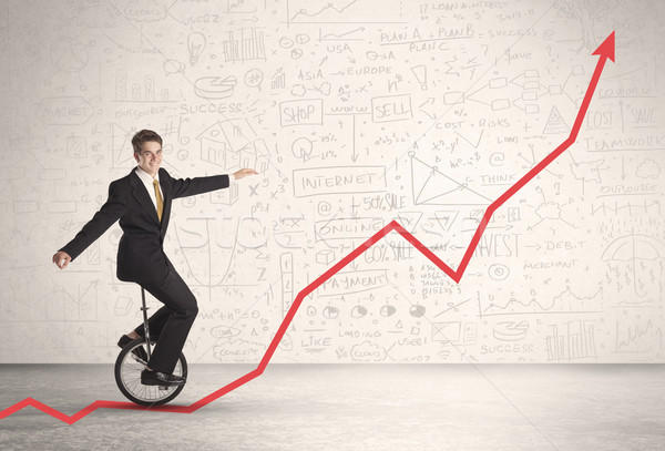 Business parson riding unicycle on an uprising red arrow  Stock photo © ra2studio