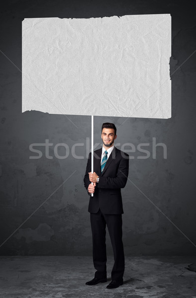üzletember füzet papír fiatal tart nagy Stock fotó © ra2studio