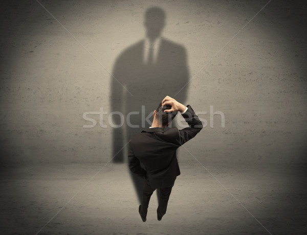 üzletember néz nagy árnyék fiatal kezdő Stock fotó © ra2studio
