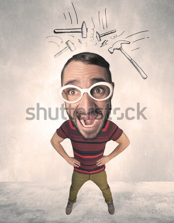 Big head person with drawn hammers Stock photo © ra2studio