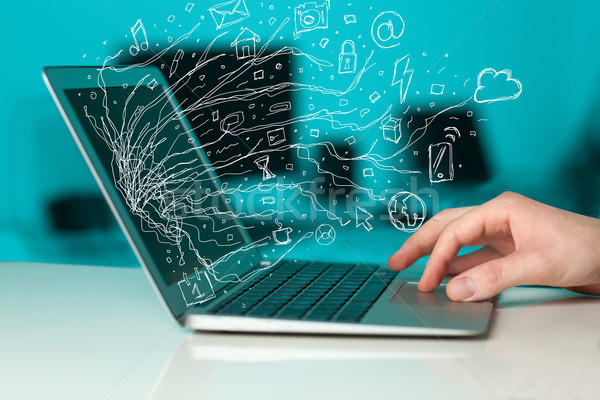 Stock photo: Man pressing notebook laptop computer with doodle icon cloud sym