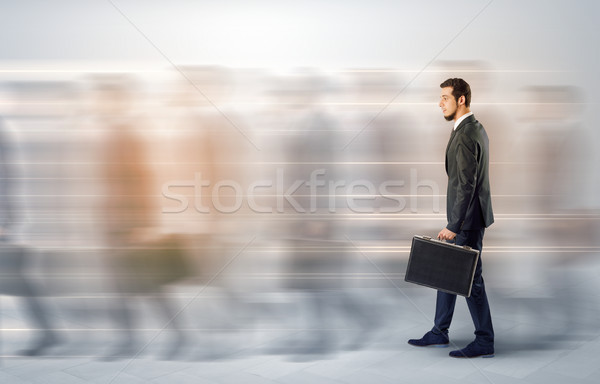 Empresario caminando lleno de gente calle jóvenes maletín Foto stock © ra2studio