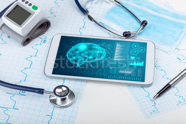 Diagnostics on tablet with brain functionality concept Stock photo © ra2studio