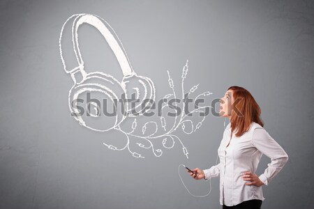 Stock photo: young woman singing and listening to music with abstract headphone