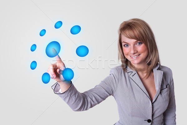 woman pressing digital buttons Stock photo © ra2studio