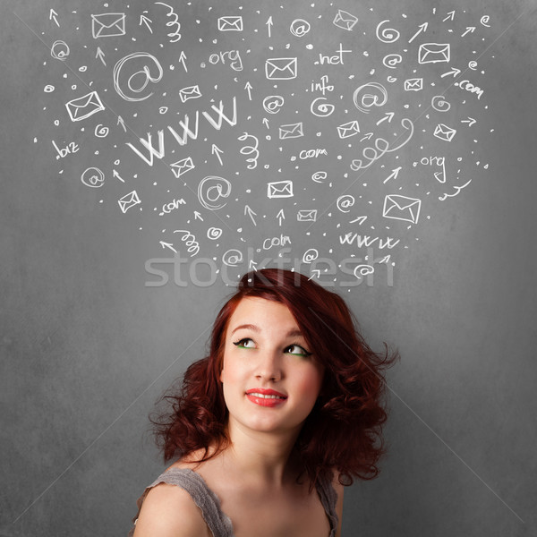Jeune femme pense réseau social icônes au-dessus tête [[stock_photo]] © ra2studio