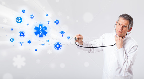 Orvos kék orvosi ikonok középkorú férfi Stock fotó © ra2studio