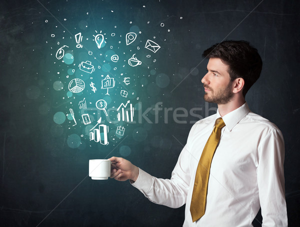 Businessman holding a white cup with business icons Stock photo © ra2studio