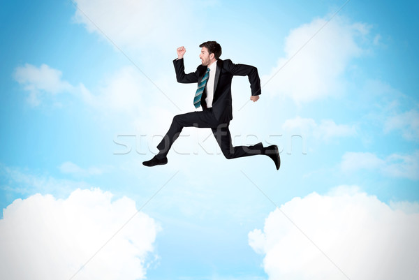 Foto stock: Empresário · saltando · nuvens · céu · blue · sky · negócio