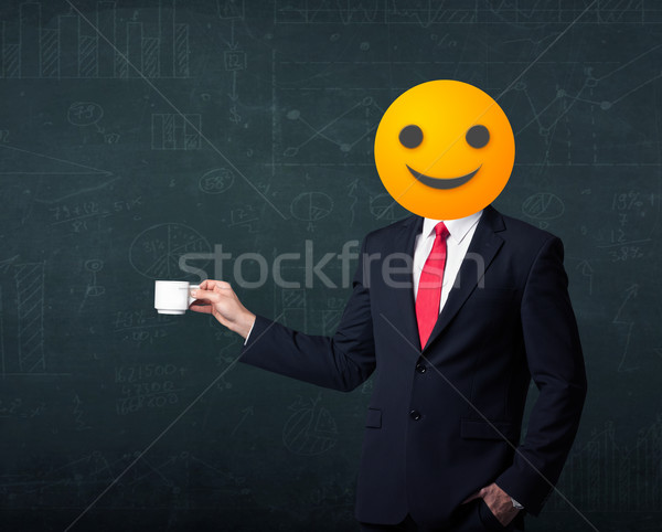 businessman wears yellow smiley face Stock photo © ra2studio