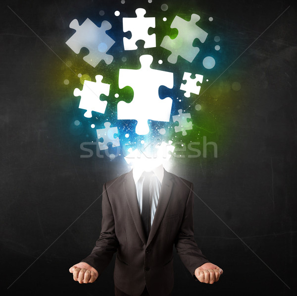 Character in suit with puzzle head concept Stock photo © ra2studio