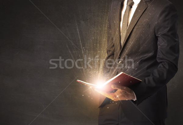 Man holding a book. Stock photo © ra2studio