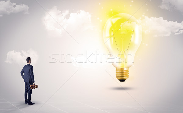 Férfi néz Föld földgömb szívesség üzletember Stock fotó © ra2studio