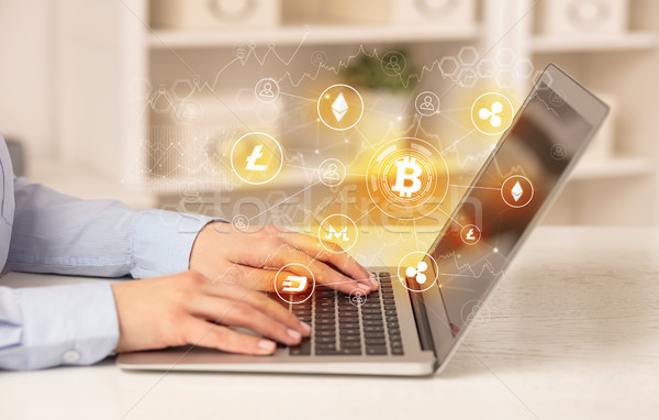 Business woman working on laptop with bitcoin link network and online concept Stock photo © ra2studio