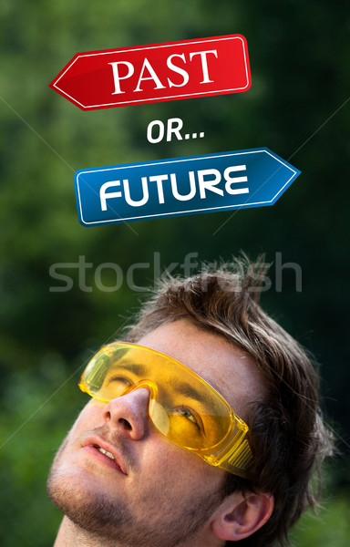 Young head looking at positive negative signs Stock photo © ra2studio