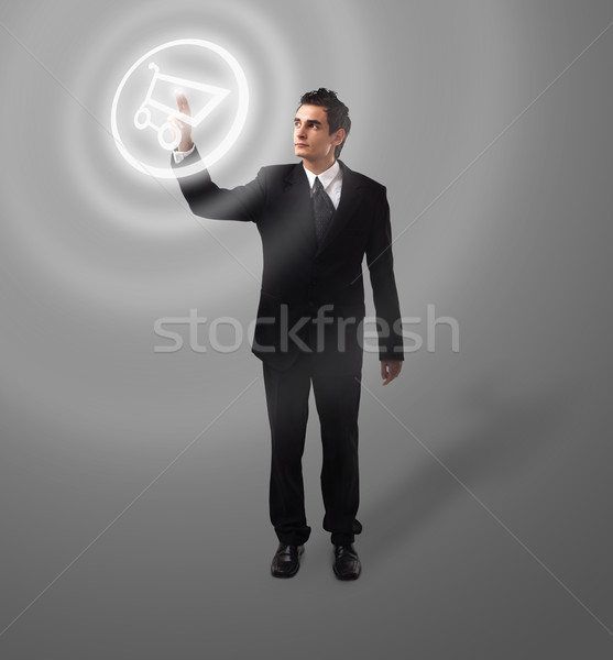 Business man pressing button Stock photo © ra2studio